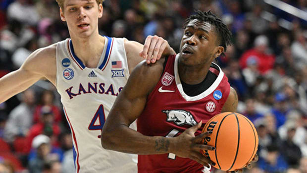 Arkansas Razorbacks guard Davonte Davis drives against the Kansas Jayhawks in the 2023 NCAA Tournament.
